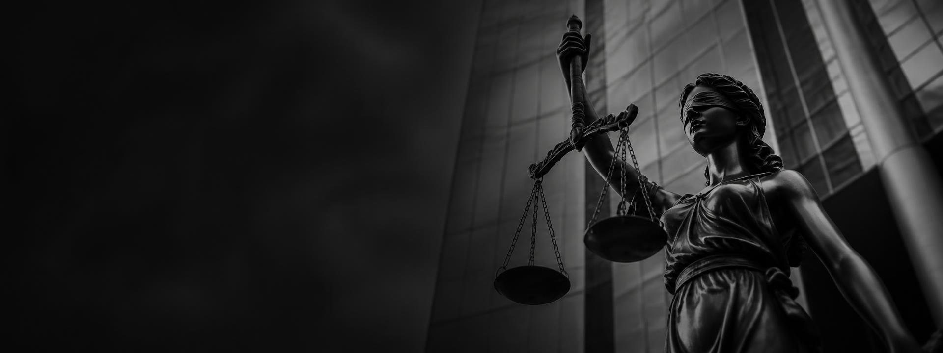 Statue of justice holding scales